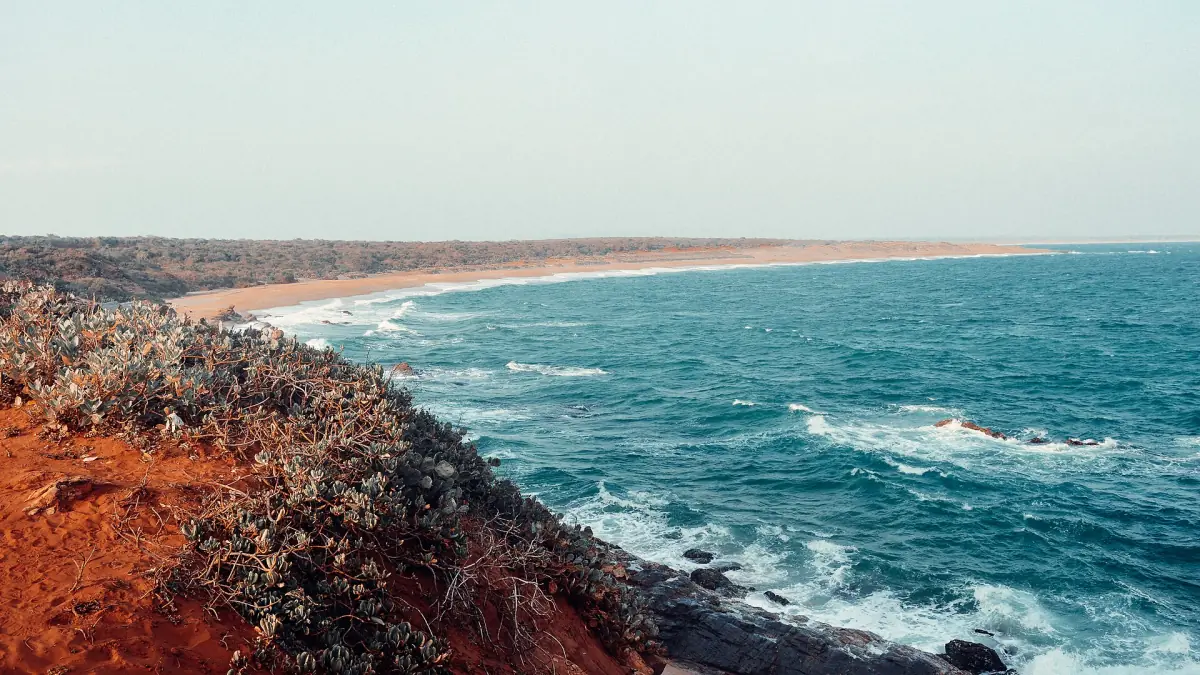 Red cliffs and surf along the coast at Bundala National Park
